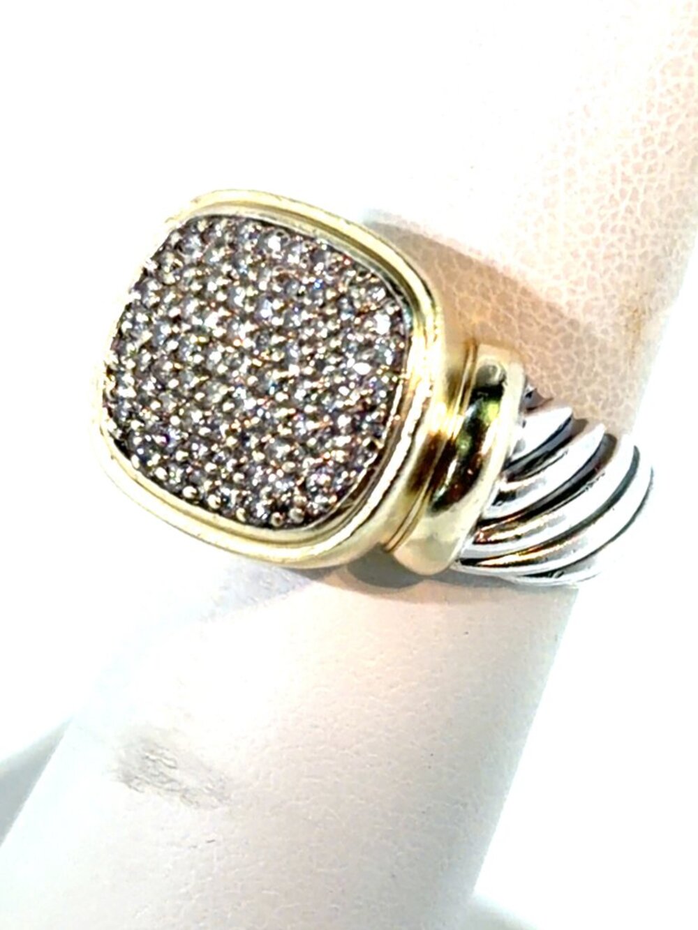 SILVER AND 18KT. YELLOW GOLD AND DIAMOND RING